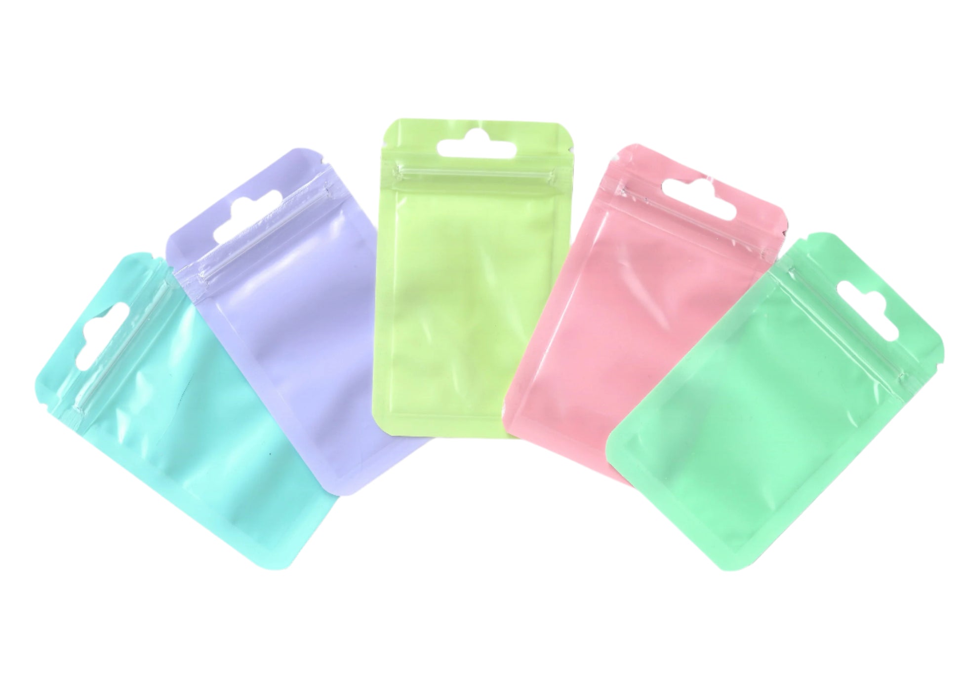 Five colorful plastic bags on a white background